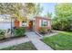 Charming single-story brick home with a covered porch and well-maintained front yard at 3620 N Saint Paul St, Denver, CO 80205