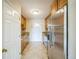 Bright kitchen with stainless steel appliances, wooden cabinets, and tiled flooring at 3620 N Saint Paul St, Denver, CO 80205