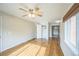 Spacious living room with gleaming hardwood floors and a ceiling fan for added comfort at 3620 N Saint Paul St, Denver, CO 80205