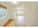 Bright living room with hardwood floors, large windows, and a ceiling fan at 3620 N Saint Paul St, Denver, CO 80205