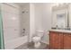 Clean bathroom with a shower-tub combination, toilet, and vanity with sink, providing essential amenities at 6276 Turnstone Pl, Castle Rock, CO 80104
