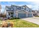 Well-maintained two-story townhome with inviting front yard and attached two-car garage at 6276 Turnstone Pl, Castle Rock, CO 80104