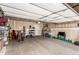 Spacious garage with ample storage space, bikes, ski equipment, and extra room for parking and projects at 6276 Turnstone Pl, Castle Rock, CO 80104