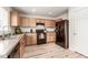 Functional kitchen features natural wood cabinetry and modern appliances at 6276 Turnstone Pl, Castle Rock, CO 80104