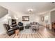 Inviting living room with wood floors, contemporary decor, and natural light at 6276 Turnstone Pl, Castle Rock, CO 80104