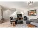 Bright living room with hardwood floors, modern lighting, and comfortable seating area at 6276 Turnstone Pl, Castle Rock, CO 80104