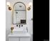 Stylish bathroom with a floating vanity and black hexagon-tile floor at 1705 S Downing St, Denver, CO 80210