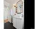 Stylish bathroom with a floating vanity and black hexagon-tile floor at 1705 S Downing St, Denver, CO 80210