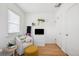 Cozy bedroom with natural light, a chair, and neutral decor at 1705 S Downing St, Denver, CO 80210