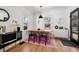 Cozy dining area with a wooden table, stylish chairs, and a modern pendant light at 1705 S Downing St, Denver, CO 80210