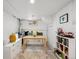 Bright dining area features a built-in banquette, storage, and natural light at 1705 S Downing St, Denver, CO 80210