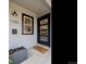 Close-up of the front porch with a modern black door and stylish house number display at 1705 S Downing St, Denver, CO 80210