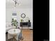 Living room featuring modern console table with decor and round mirror at 1705 S Downing St, Denver, CO 80210