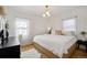 Bright bedroom with natural light, hardwood floors, and minimal decor at 1705 S Downing St, Denver, CO 80210