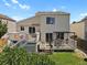 Backyard with deck, patio with pergola, grassy area, and two-story home exterior at 20356 Willowbend Ln, Parker, CO 80138