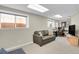 Functional finished basement with a comfortable seating area and a dedicated workspace, perfect for relaxing at 20356 Willowbend Ln, Parker, CO 80138