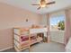 Charming ' bedroom featuring bunk beds, soft decor, and a bright window, creating a cozy space at 20356 Willowbend Ln, Parker, CO 80138