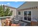 Relaxing deck area features modern outdoor furniture, awning, and sliding glass door access at 20356 Willowbend Ln, Parker, CO 80138