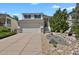 Charming two-story home with a two-car garage and beautifully landscaped front yard at 20356 Willowbend Ln, Parker, CO 80138