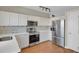 Bright kitchen with white cabinets, stainless steel appliances, and modern countertops at 20356 Willowbend Ln, Parker, CO 80138
