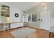 Bright living room featuring custom built-ins, a large window, and hardwood flooring at 20356 Willowbend Ln, Parker, CO 80138