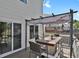 Outdoor patio with dining area, pergola, sliding glass door access to home interior at 20356 Willowbend Ln, Parker, CO 80138