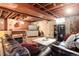 Cozy finished basement with a plush leather couch and media center setup at 5332 W Roxbury Pl, Littleton, CO 80128