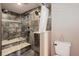 Modern bathroom featuring a stylish walk-in shower with double shower heads at 5332 W Roxbury Pl, Littleton, CO 80128