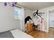 A bedroom showcasing a desk and chair, a whimsically painted wall design, and hardwood floors at 5332 W Roxbury Pl, Littleton, CO 80128