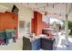 Inviting covered patio with a spa, outdoor seating, string lights, and a ceiling fan to enjoy outdoor relaxation at 5332 W Roxbury Pl, Littleton, CO 80128