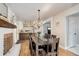 Charming dining room with hardwood floors, fireplace, and seamless flow to the kitchen at 5332 W Roxbury Pl, Littleton, CO 80128