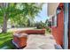 Inviting front porch with a brick wall, offering a cozy spot for relaxing outdoors on a sunny day at 5332 W Roxbury Pl, Littleton, CO 80128