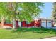 Traditional home showcasing a lush front lawn, mature trees, and well-maintained landscaping at 5332 W Roxbury Pl, Littleton, CO 80128