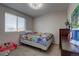 Bedroom with full-size bed and window coverings at 11673 Josephine St, Thornton, CO 80233