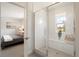 Modern bathroom featuring a glass-enclosed shower with white subway tile and a built-in bench at 4006 Upham St, Wheat Ridge, CO 80033