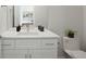 Modern bathroom with a quartz countertop vanity and sleek fixtures at 4006 Upham St, Wheat Ridge, CO 80033
