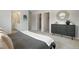 Bedroom featuring a decorative cabinet, neutral walls, soft carpet, and stylish furnishings at 4006 Upham St, Wheat Ridge, CO 80033