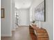 Bright entryway with wood floors, modern console table and striking artwork at 4006 Upham St, Wheat Ridge, CO 80033