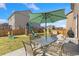 Great backyard with a patio, patio furniture, and play set at 567 Jewel St, Brighton, CO 80603