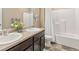 Bright bathroom featuring a double sink vanity and a shower-tub combination at 567 Jewel St, Brighton, CO 80603