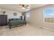 Spacious bedroom with neutral carpet, large windows, and a ceiling fan at 567 Jewel St, Brighton, CO 80603