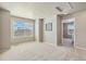 Bedroom with carpeted floors, neutral paint, and bright natural light from large window at 567 Jewel St, Brighton, CO 80603