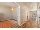 Inviting entryway showcasing hardwood floors, neutral walls, and an open floor plan with natural light at 567 Jewel St, Brighton, CO 80603