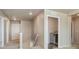 Hallway with carpeted floors, neutral paint, and access to laundry and bedrooms at 567 Jewel St, Brighton, CO 80603