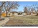 Spacious backyard showcasing a home's layout and design with a shed and outdoor space at 51 S Eaton St, Lakewood, CO 80226