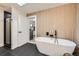 Modern bathroom features a freestanding tub, sleek black shower, and decorative tile at 51 S Eaton St, Lakewood, CO 80226