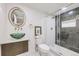 Contemporary bathroom featuring a glass bowl sink, gold fixtures, and an elegant shower at 51 S Eaton St, Lakewood, CO 80226