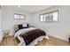 Bedroom showcasing two windows and a comfortable bed with neutral tones at 51 S Eaton St, Lakewood, CO 80226