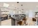 Modern kitchen featuring a large island, stainless steel appliances, and a light-filled open layout at 51 S Eaton St, Lakewood, CO 80226