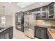 Modern kitchen featuring stainless steel appliances, custom cabinets, and a functional layout at 51 S Eaton St, Lakewood, CO 80226